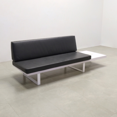 Astoria Custom Lobby Sofa in black leatherette, white matte laminate frame with extension and white metal legs shown here.