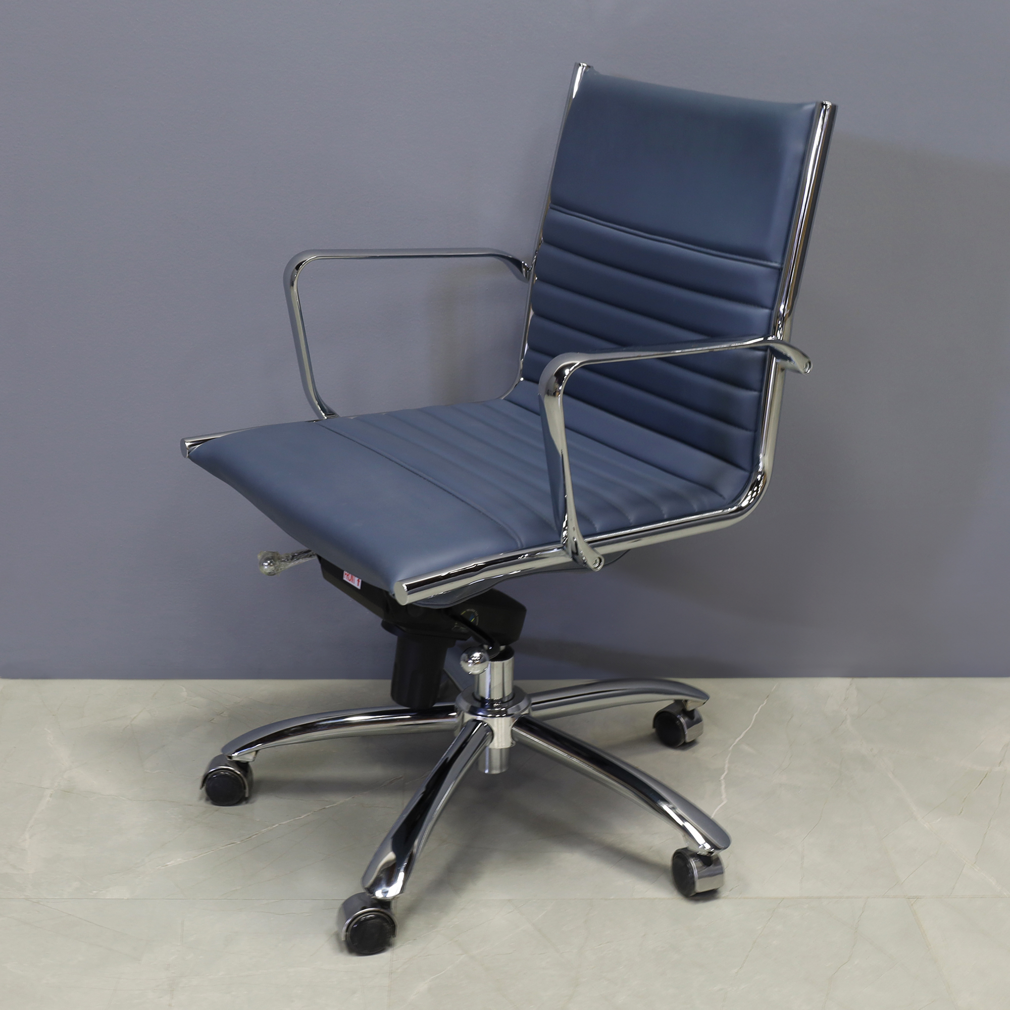 Dirk Low Back Office Chair in Blue Leatherette, shown here.