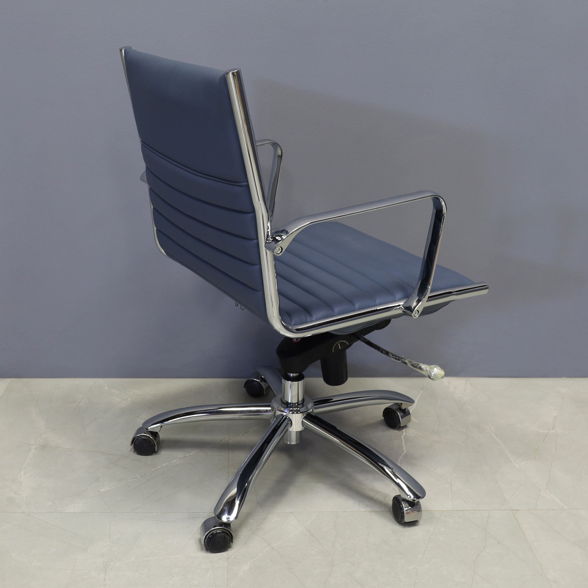 Dirk Low Back Office Chair in Blue Leatherette, shown here.