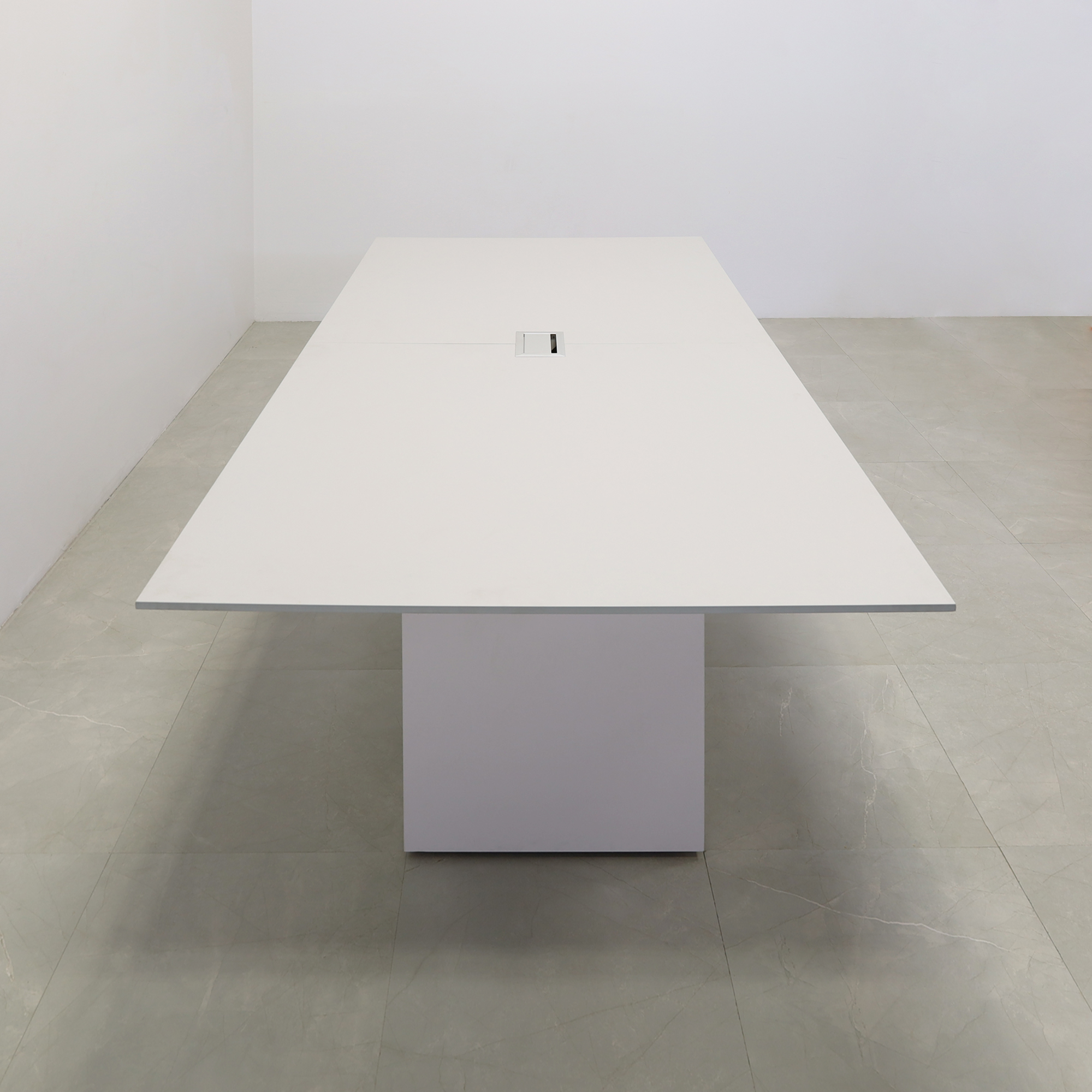 102 inches Aurora Rectangular Conference Table in Light Gray Engineered Stone Top and White Matte Laminate finish base. One Ellora power box shown here.