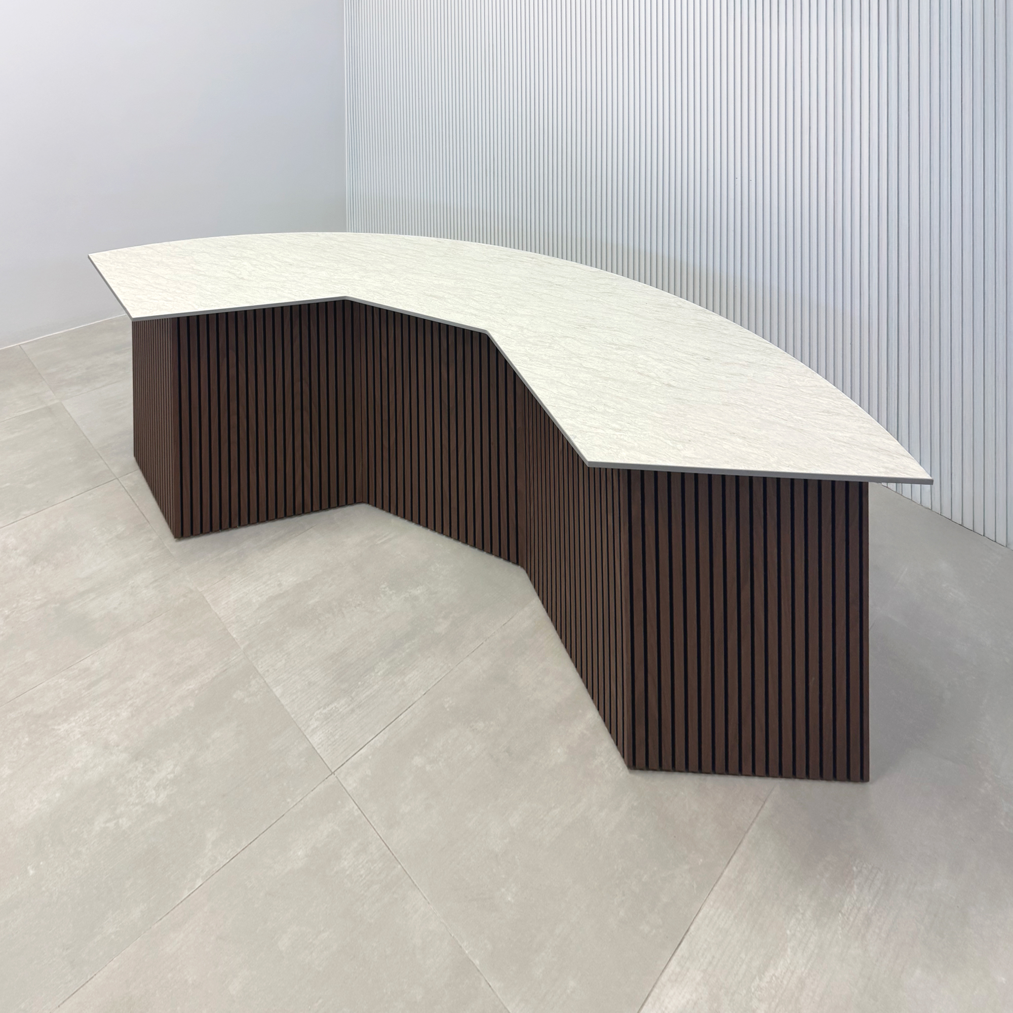 90-inch Tampa Bay Podcast Table with Spanish Limestone Engineered Surface Top and Walnut Tambour with Black Background.