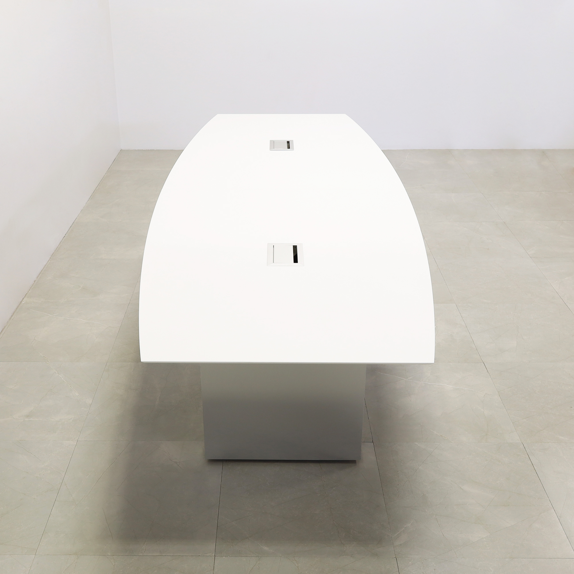 119 inches Aurora Boat Shaped Conference Table with White Solid Engineered Stone Top and Brushed Aluminum finish base, two Ellora power boxes shown here.