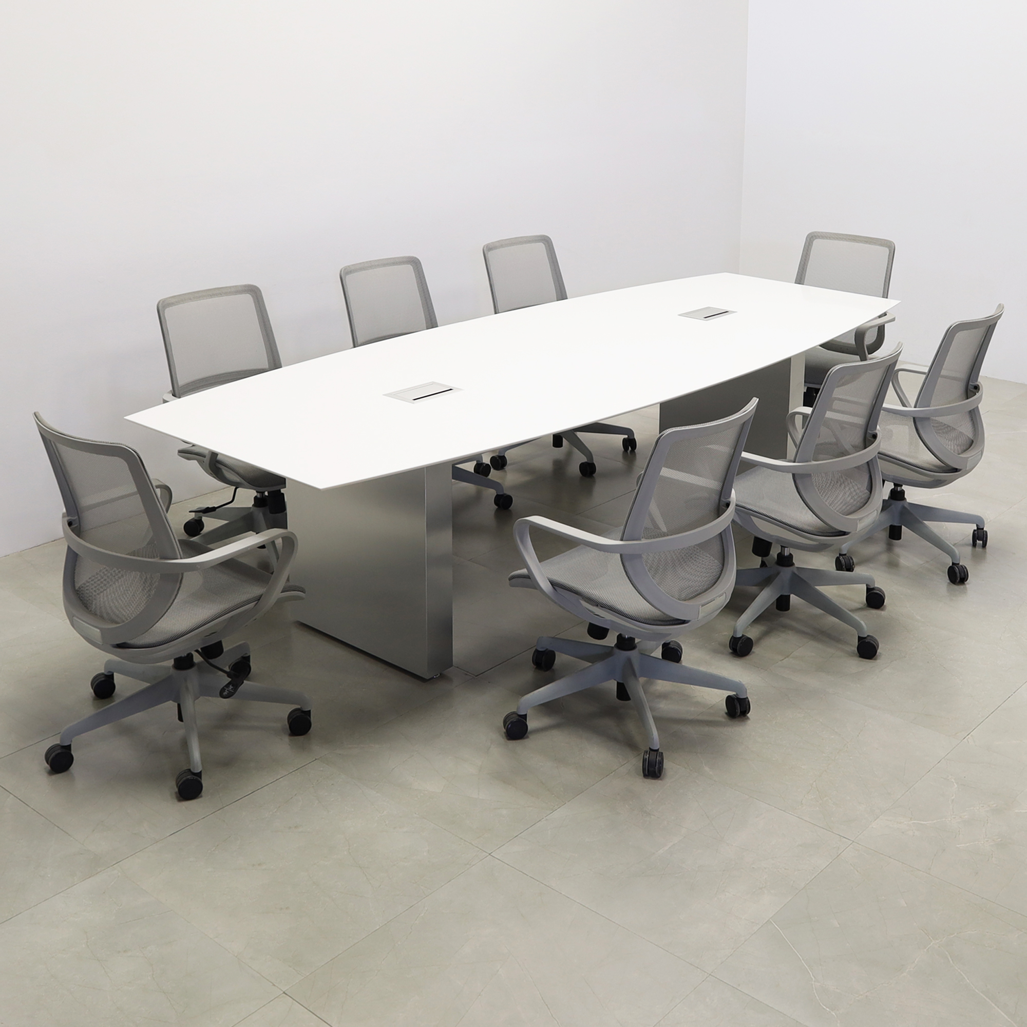 119 inches Aurora Boat Shaped Conference Table with White Solid Engineered Stone Top and Brushed Aluminum finish base, two Ellora power boxes, and eight gray chairs shown here.