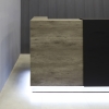 108-inch Custom Chicago Reception Desk in concrete PVC desk, black traceless laminate counter and brushed aluminum toe-kick, with white LED shown here.