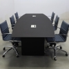 114 inches Aurora Boat Shape Conference Table with Black Traceless Engineered Stone top with two Ellora power boxes and black matte laminate base, and six blue chairs shown here. 