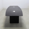 Aurora Boat Shape Conference Table With Engineered Stone Top in black amani top and black matte laminate base with two ellora power boxes shown here.