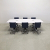 120 inches Newton Boat Shaped Conference Table in White Gloss Laminate finish top and base, Two Ellora power boxes, and six blue chairs shown here.