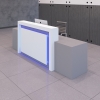 120-inch New York Extra Wide Custom Reception Desk in white matte laminate counter and front panel, and stprm gray matte laminate desk and accent, with color LED, shown here.