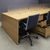132-inches aXis Custom Workstation in special custom laminate top, legs and storage, with three frosted acrylic partitions shown here.