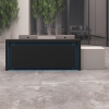 144-inch New York ADA Compliant Custom Reception Desk in black traceless laminate counter and front panel, and folkstone gray matte laminate desk, with color LED, shown here.
