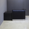96-inch Austin ADA Reception Desk in madagascar matte laminate counter & desk, black traceless tambour front accent panel, brushed aluminum toe-kick, with warm white LED shown here.