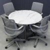 42 inches California Round Conference Table in calcutta blanc engineered stone top and brushed stainless steel base shown here.