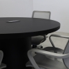 Newton Round Conference Table With Laminate Top in black matte laminate top and base with nacre power box shown here.