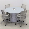 Omaha Round Conference Table With Tempered Glass Top in baby blue top and calcutta stone pvc laminate base, with one ellora power box shown here.