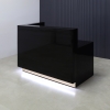 Dallas L-Shape Custom Reception Desk, left side l-panel when facing front in black gloss laminate main desk and gold aluminum toe-kick, with white LED shown here.