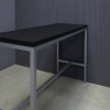 60-inch Aspen Bar Table in black traceless laminate top and gray metal frame shown here.