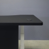 60-inch aXis Sit-stand Executive Desk with black traceless laminate top and privacy panel and white metal legs shown here.