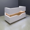 Wave Reception Desk in white matte laminate desk and counter, white oak wave accent front and brushed aluminum toe-kick, with warm white LED shown here.