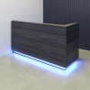 Dallas L-Shape Custom Reception Desk, right side l-panel when facing front in storm teakwood laminate main desk and brushed aluminum toe-kick, with multi-colored LED shown here.