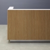 84-inch Dallas L-Shape Custom Reception Desk left side l-panel when facing front in white oak tambour main desk, and white matte laminate workspace, with brushed aluminum toe-kick, shown here.