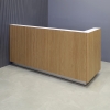 84-inch Dallas L-Shape Custom Reception Desk right side l-panel when facing front in white oak tambour main desk, and white matte laminate workspace, with brushed aluminum toe-kick, shown here.