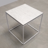 Aspen Square Side Lobby Table in spanish limestone engineered stone top in white metal frame shown here.