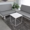 Aspen Square Side Lobby Table in white solid engineered stone top in white metal frame shown here.