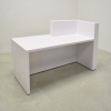 Atlanta reception desk with white gloss finish, white oak tambour front accent and colored LED shown here. 