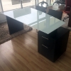 Avenue Curved Executive Desk with black matte desk finish and white glass shown here. 
