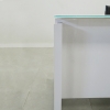 Denver Straight Glass Top Desk is shown here with a White gloss Laminate Base and a White glass top.