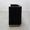 Nola Custom Reception Desk is shown here with a Black Gloss Laminate Base and gold Toe-kick.