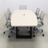 92 inches Newton Boat Shaped Conference Table in Beige Traceless Laminate Top with one Ellora power box and Black Traceless open legs, and five gray chairs shown here. 