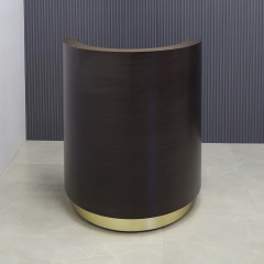 Lima Round Podium & Host Custom Desk in ebony recon matte laminate desk and brushed gold toe-kick shown here.