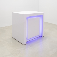 New York Retail CUstom Reception Desk in white matte laminate front panel and workspace, with multi-colored LED shown here.